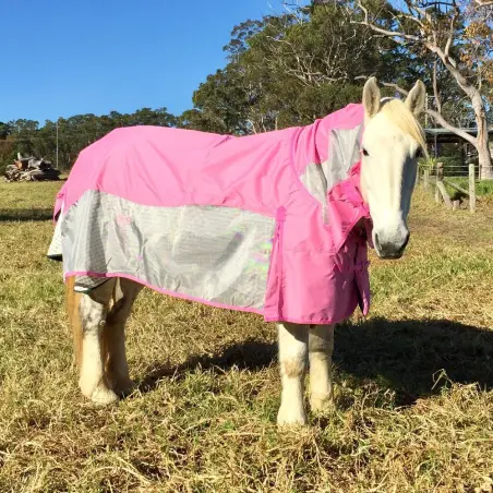 horse wearing pink rainsheet mesh hybrid with pink waterproof top layer and silver mesh side panels